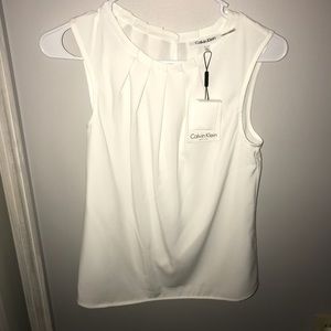 white sleeveless blouse | calvin klein